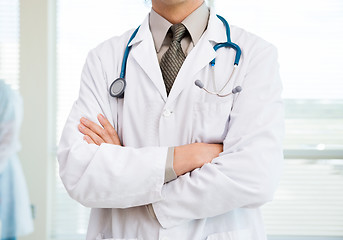 Image showing Cancer Specialist Standing Arms Crossed In Hospital Room