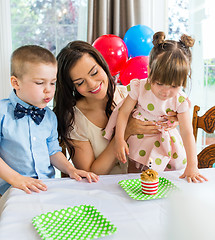 Image showing Family Celebrating Girl's Birthday