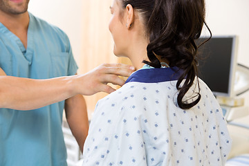 Image showing Nurse Examining Patient's Neck Before Ultrasound Test