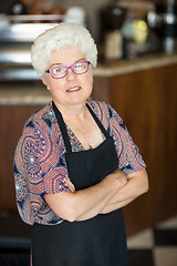 Image showing Owner With Arms Crossed Standing In Cafeteria