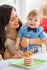 Image showing Baby Boy And Mother With Birthday Cake On Table