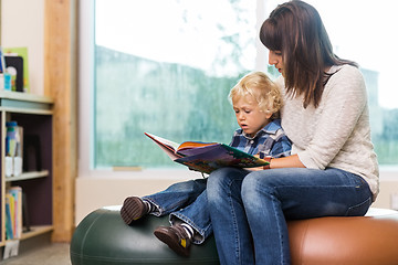 Image showing Teacher With Schoolboy Reading Book