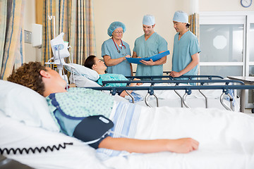 Image showing Nurses Examining Patient's Test Report