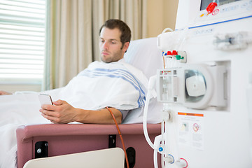 Image showing Patient Using Mobilephone at Dialysis Center