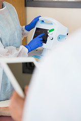 Image showing Nurse Operating Heartbeat Machine In Hospital