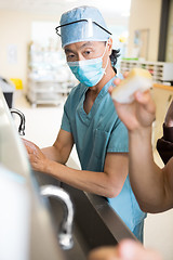 Image showing Surgeon Scrubing Arms and Hands