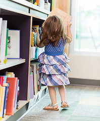 Image showing Girl Selecting Book In Library