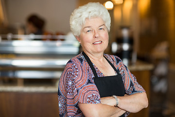 Image showing Owner With Arms Crossed Standing In Cafe