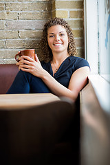 Image showing Happy Woman With Coffee Mug In Cafe