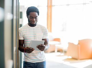 Image showing Student Using Digital Tablet At Library