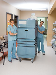 Image showing Nurses Pushing Trolley In Hospital Hallway