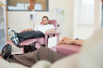 Image showing Man With IV Drip Attached To His Hand