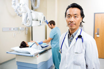 Image showing Radiologist With Nurse Preparing Patient For Xray