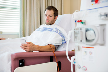 Image showing Patient Using Mobilephone at Dialysis Center