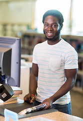 Image showing Librarian Scanning Books At Counter In Library