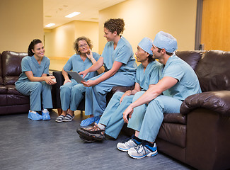 Image showing Doctor Showing Digital Tablet To Team