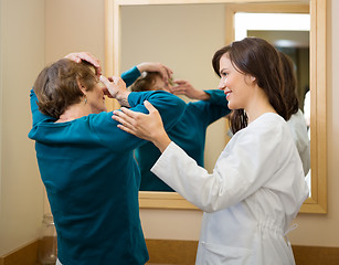 Image showing Ophthalmologist Assisting Woman To Insert Contact Lens