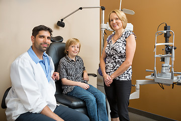 Image showing Optician With Customers Smiling In Store