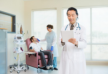 Image showing Doctor Using Digital Tablet In Chemo Room