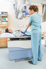 Image showing Nurse Adjusting Xray Machine For Patient