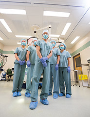 Image showing Medical Team In Scrubs Standing Inside Operation Room