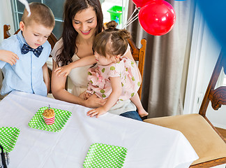 Image showing Mother And Children Celebrating Birthday Party