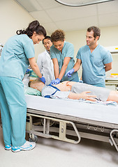 Image showing Medical Team Performing CPR On Dummy Patient