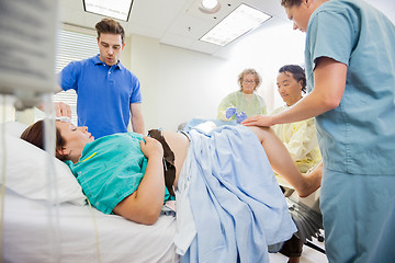 Image showing Man Wiping Sweat From Woman's Forehead