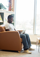 Image showing Student Using Digital Tablet In Bookstore