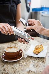 Image showing Customer Paying using NFC