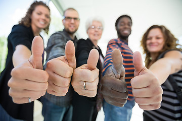 Image showing Multiethnic University Students Gesturing Thumbsup