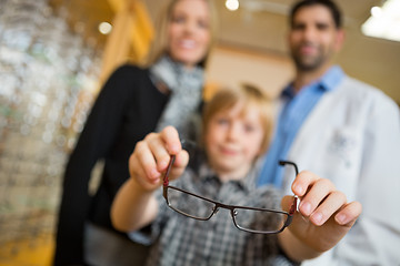 Image showing Boy Showing Glasses With Mother And Optician In Store