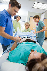 Image showing Man Holding Woman's Hand During Delivery In Hospital