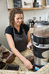 Image showing Barista Making Coffee In Cafe