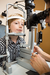 Image showing Boy Having His Eye Tested With Slit Lamp By Doctor