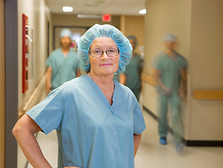 Image showing Doctor With Team Walking In Hospital Corridor