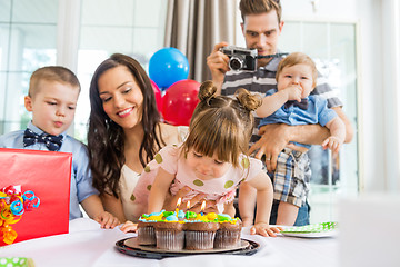 Image showing Family Celebrating Girl's Birthday At Home