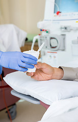 Image showing Nurse Giving Crushed Ice To Patient On Renal Dialysis