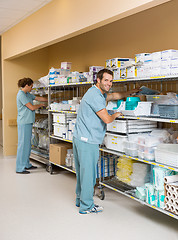 Image showing Nurses Arranging Stock On Shelves In Storage Room