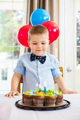 Image showing Boy Looking At Birthday Cake