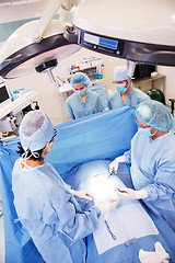 Image showing Surgeons Operating in Surgical Theater