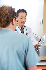 Image showing Nurse With Doctor Using Digital Tablet At Reception