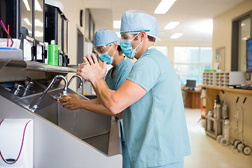 Image showing Surgical Staff Scrubbing Hands and Arms