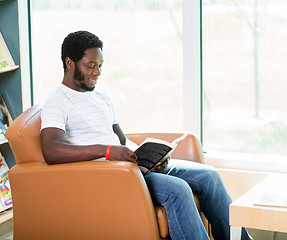 Image showing Student Reading Book In Library