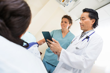 Image showing Medical Team With Female Patient In Examination Room