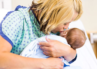 Image showing Mother Kissing Newborn Babygirl In Hospital