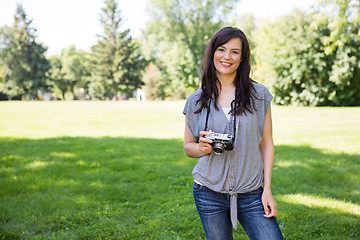 Image showing Woman With Digital Camera In Park