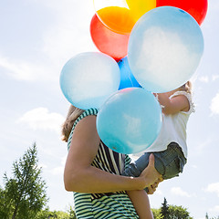 Image showing Mother And Daughter With Balloons In Park