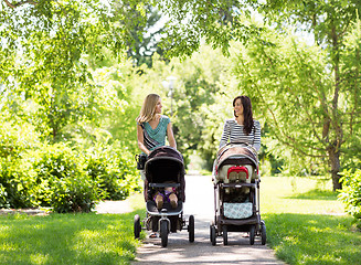 Image showing Mothers With Baby Carriages Walking In Park