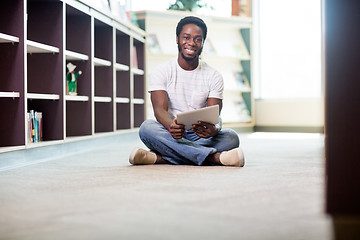 Image showing Student With Digital Tablet Sitting In Library